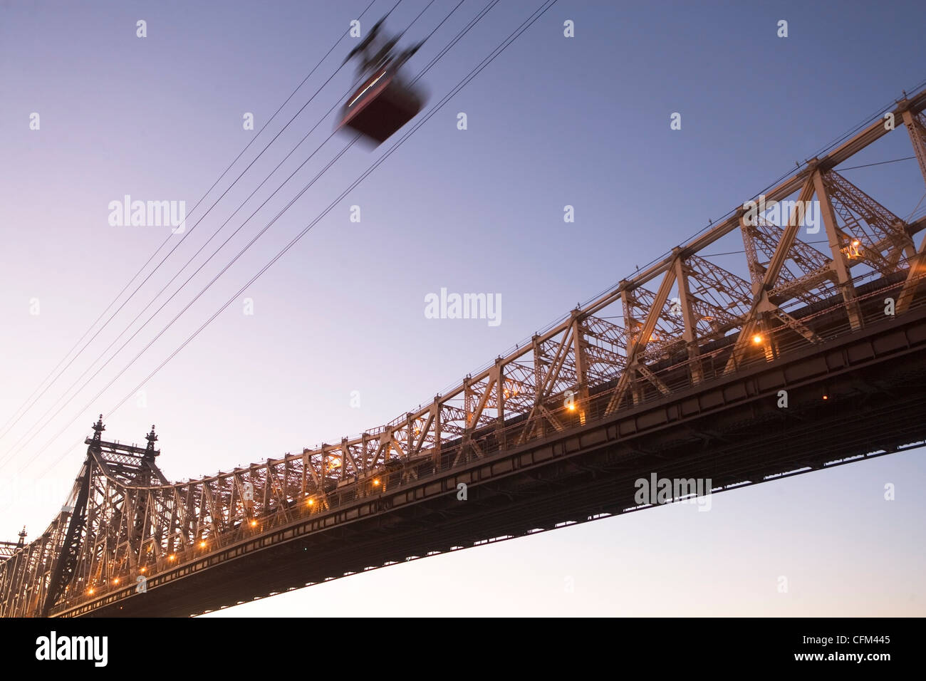 USA, New York, New York City, Manhattan, Queensboro Bridge, Overhead cable car at dusk Stock