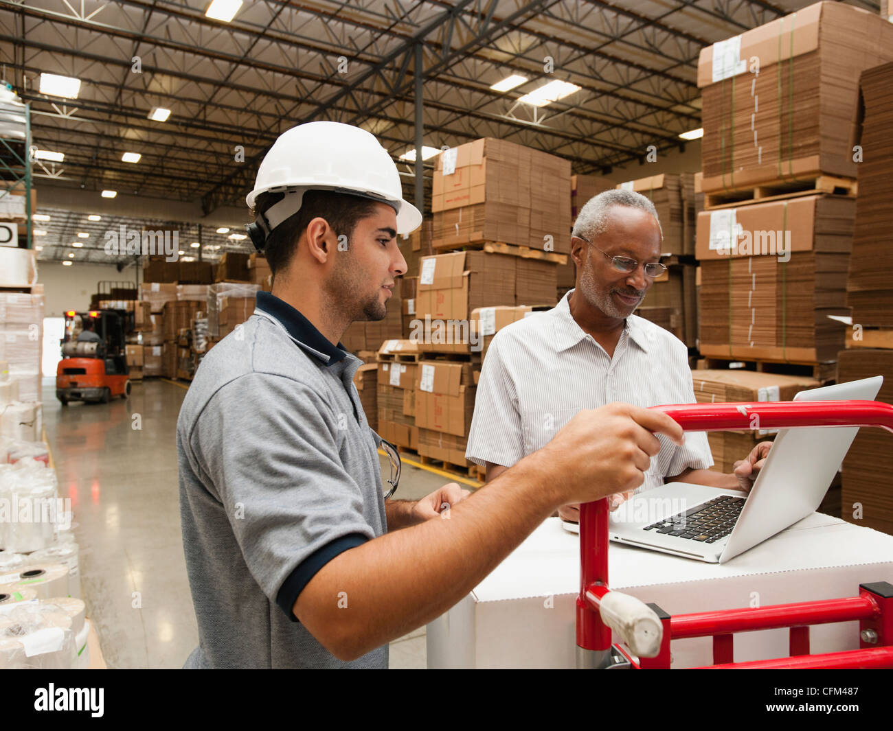 USA, California, Santa Ana, Men working in warehouse Stock Photo