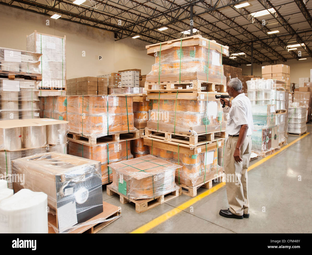 USA, California, Santa Ana, Warehouse worker scanning delivery Stock