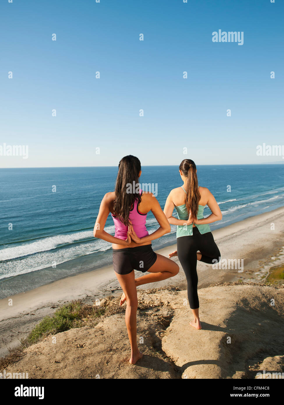 Two women only beach back view hi-res stock photography and images - Alamy