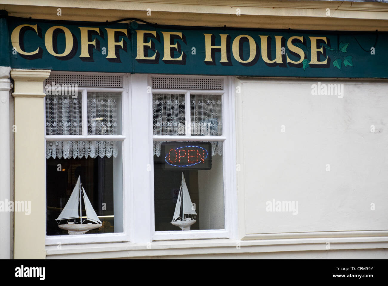 Coffee House in Weymouth, Dorset UK with two sailing boats in windows
