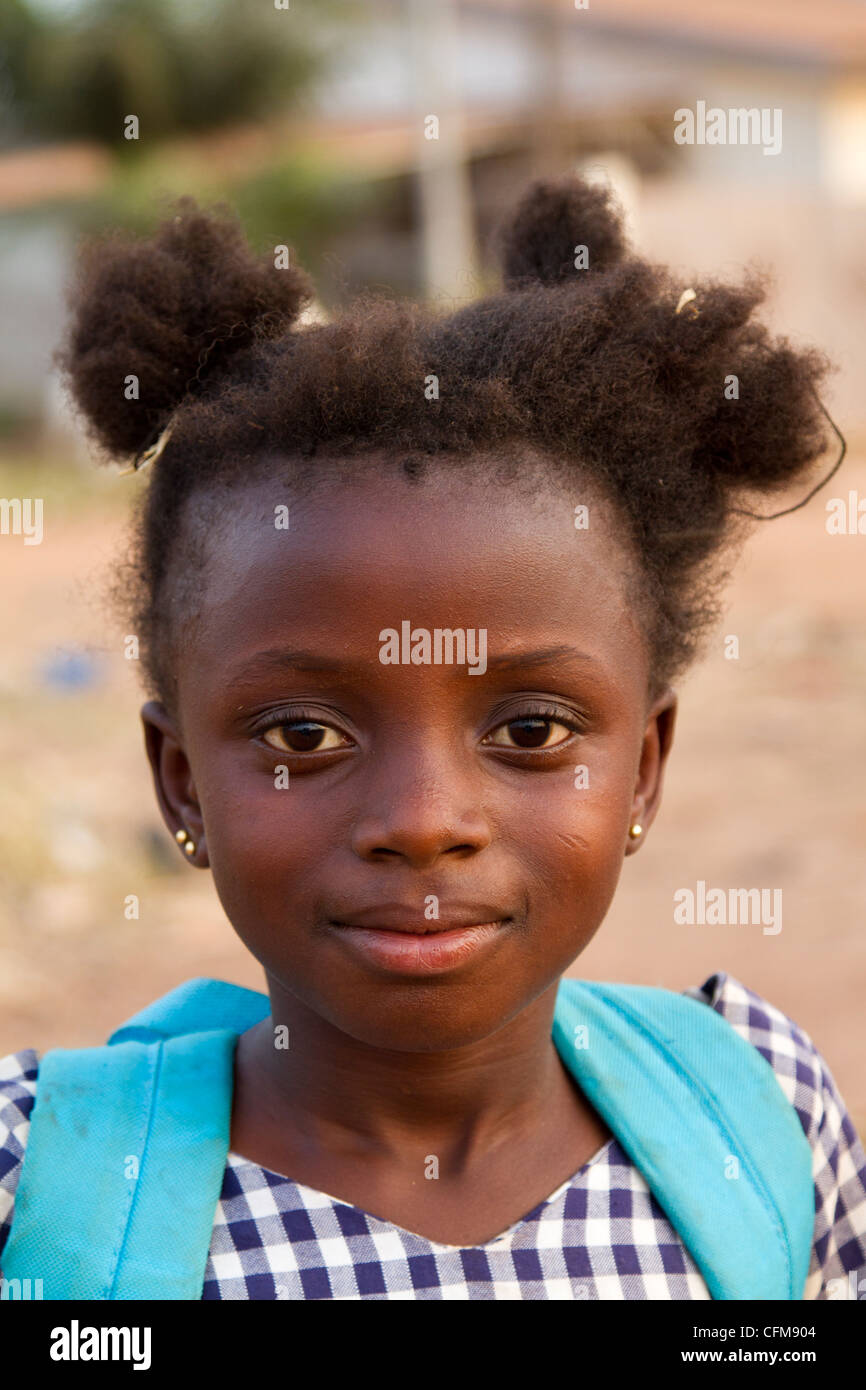 schoolgirl going back to school in Dukoue,Ivory Coast ,Cote d'Ivoire,West Africa Stock Photo