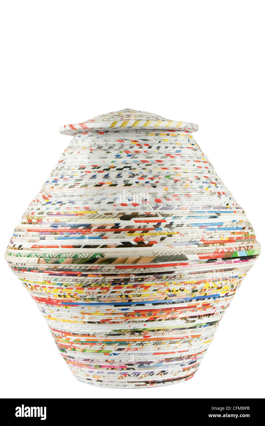 colored basket made from recycled paper on white background Stock Photo