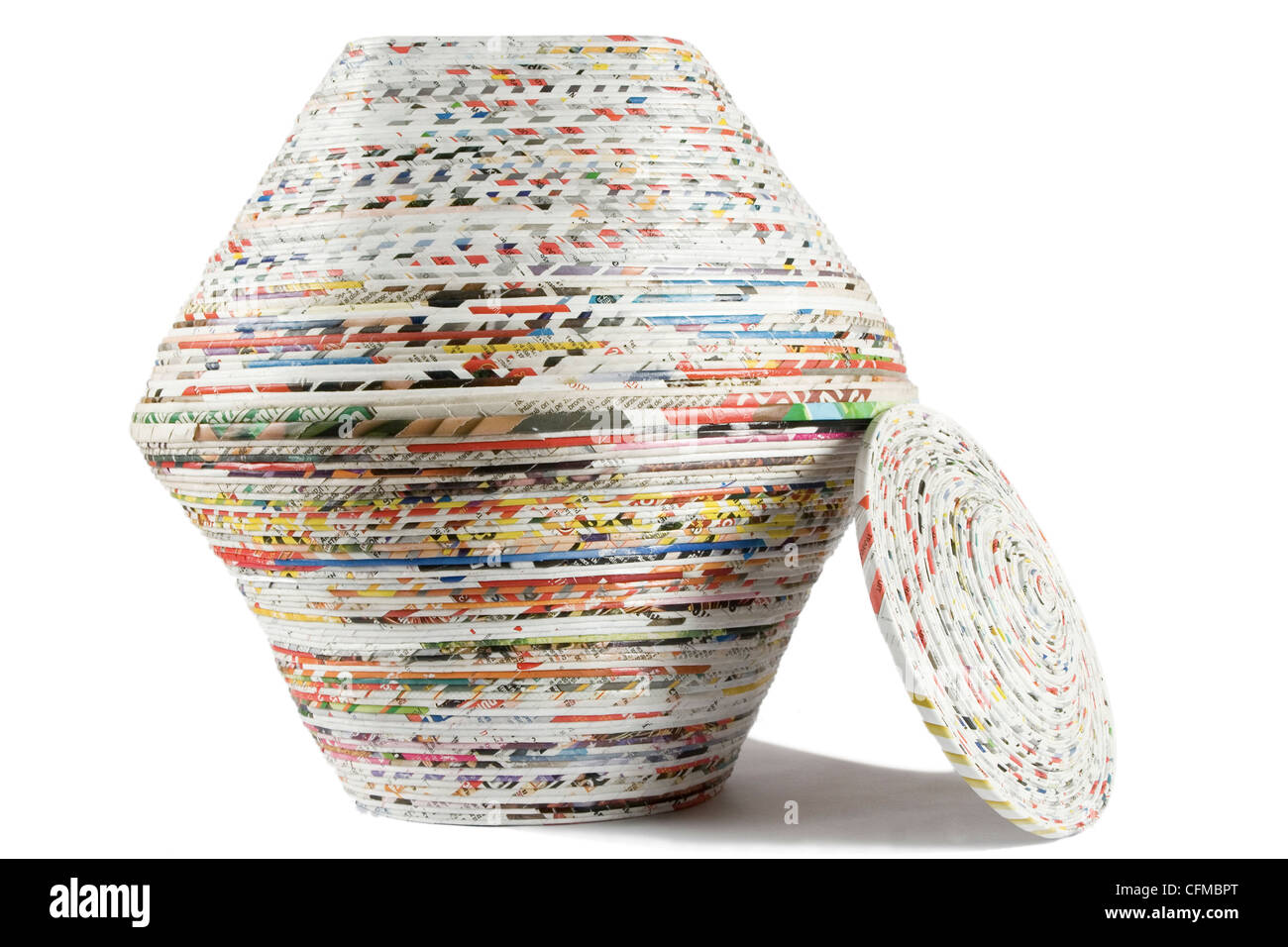 colored basket made from recycled paper on white background Stock Photo