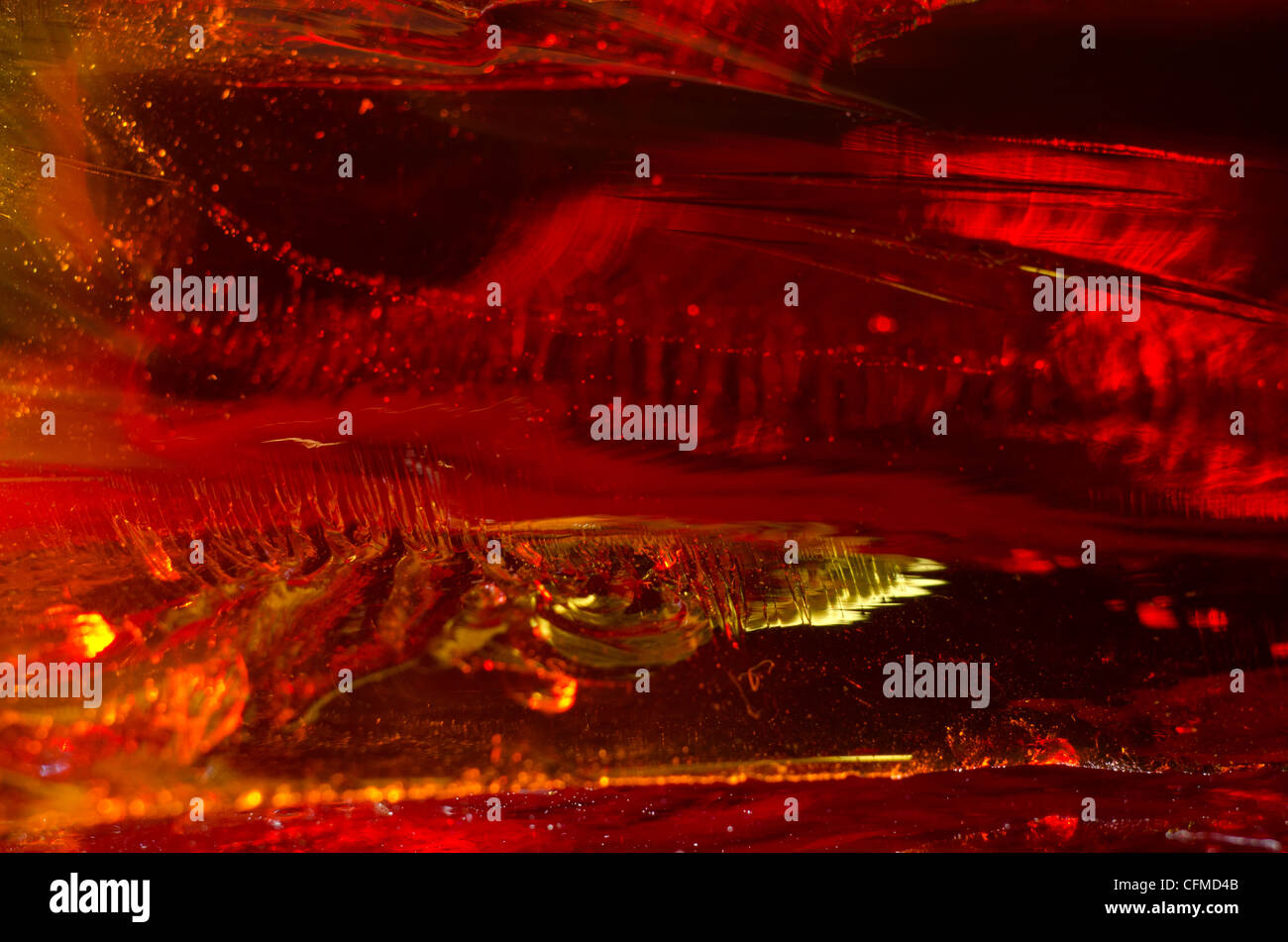 Macro image of red glass block showing imperfections Stock Photo Alamy
