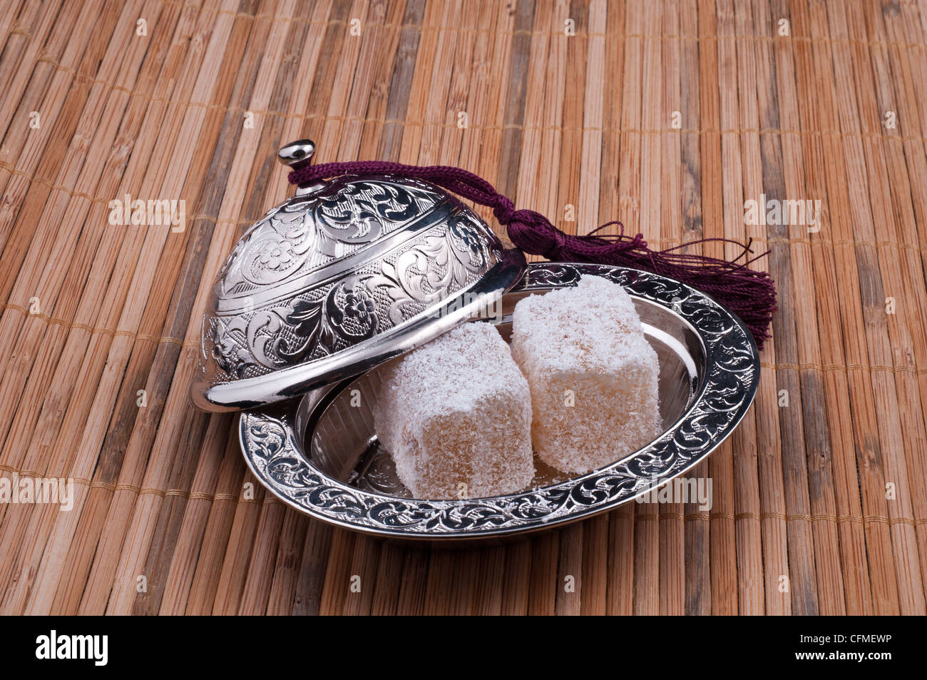 Open Silver Serving Bowl with Two Pieces of Turkish Delight – Elegant Dessert Presentation Stock Photo