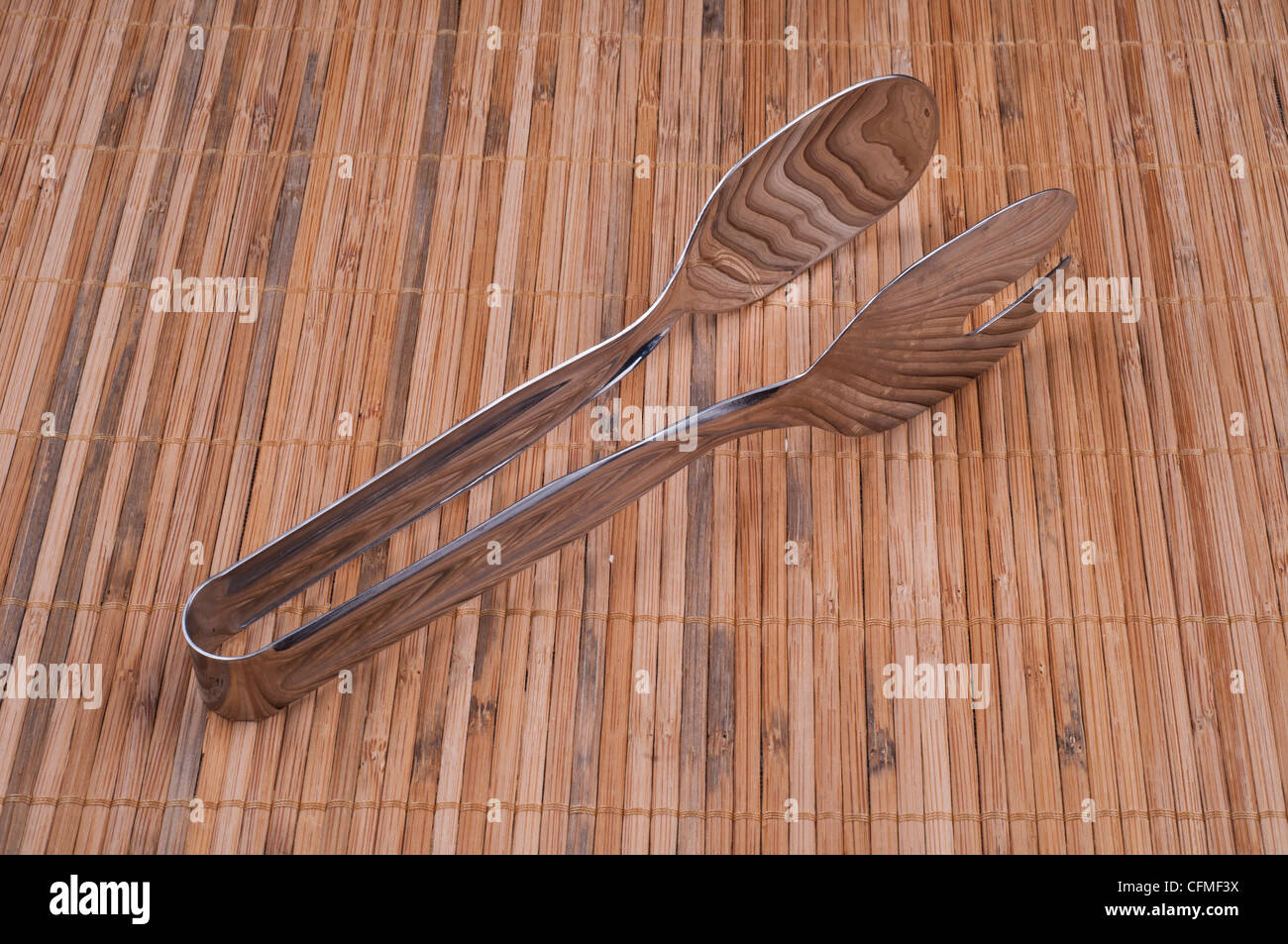Kitchen Steel Tongs on isolated background Stock Photo