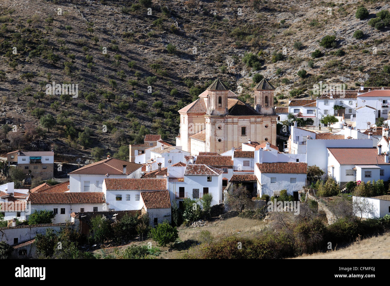 View of the town and church, Alpandeire, Serrania de Ronda, Malaga Province, Andalucia, Spain, Western Europe. Stock Photo