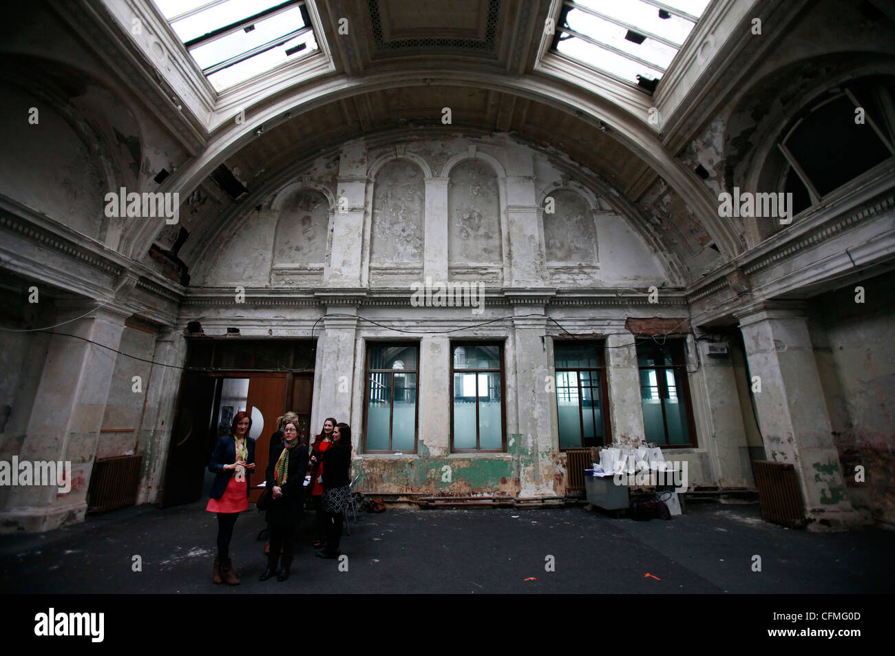 People are seen in the old unused drawing offices of Harland & Wolff in Belfast, Northern Ireland Stock Photo