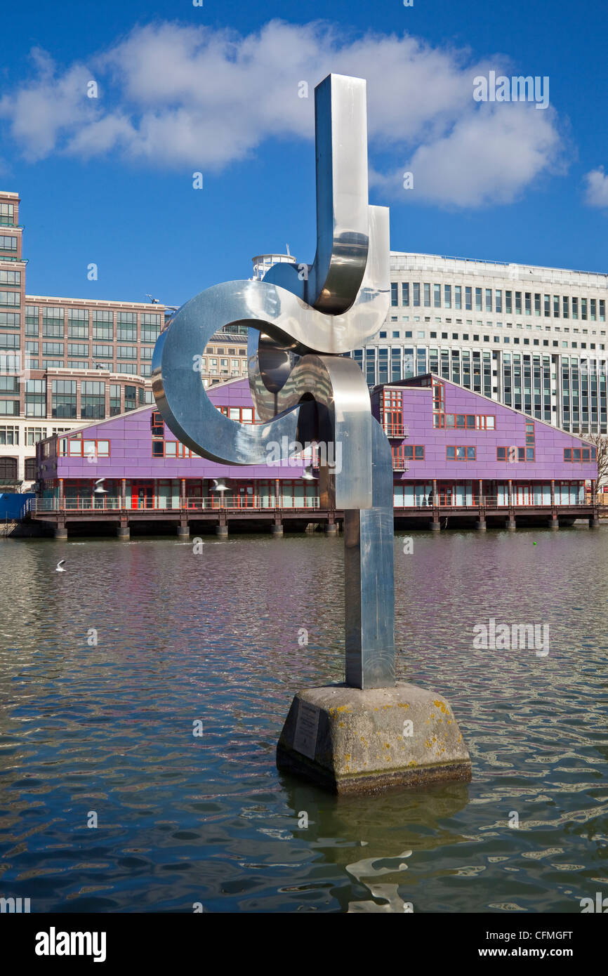 London, Canary Wharf   Wendy Taylor's 'Spirit of Enterprise' in West India dock Heron Quays in the background March 2012 Stock Photo