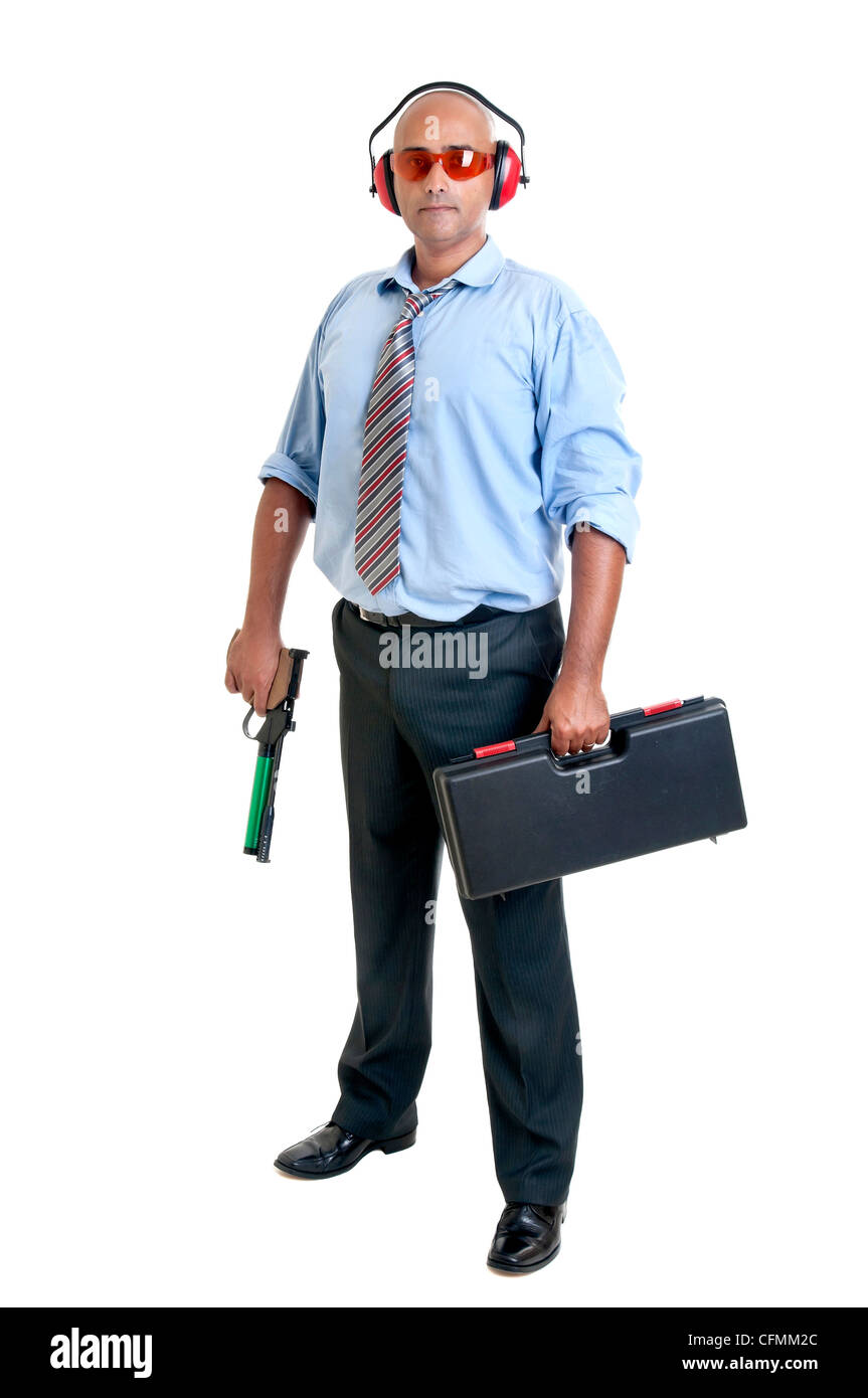 Businessman with compressed air gun Stock Photo