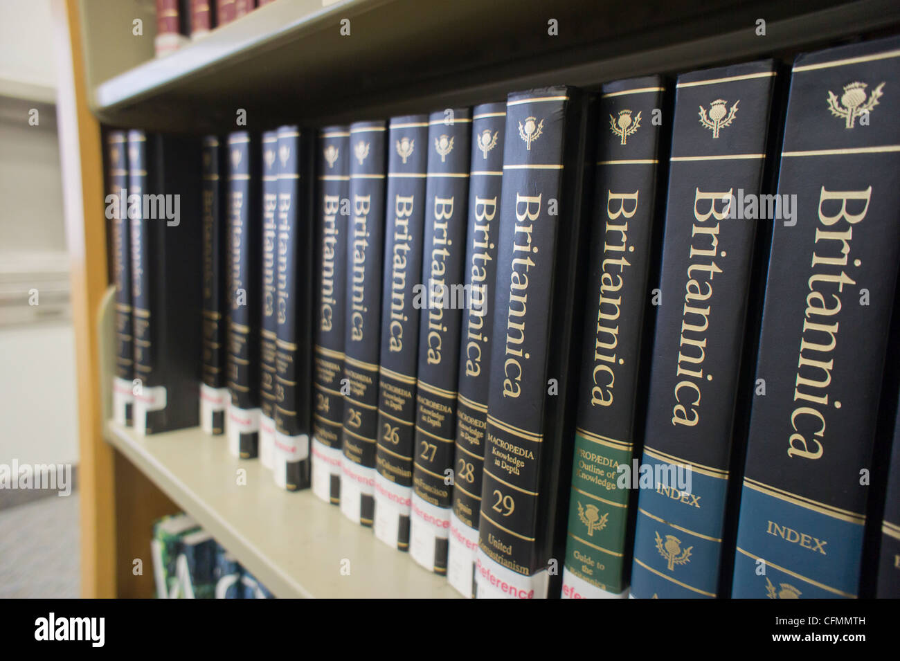 The multi-volume Encyclopaedia Britannica is seen on a library reference shelf in New York Stock Photo