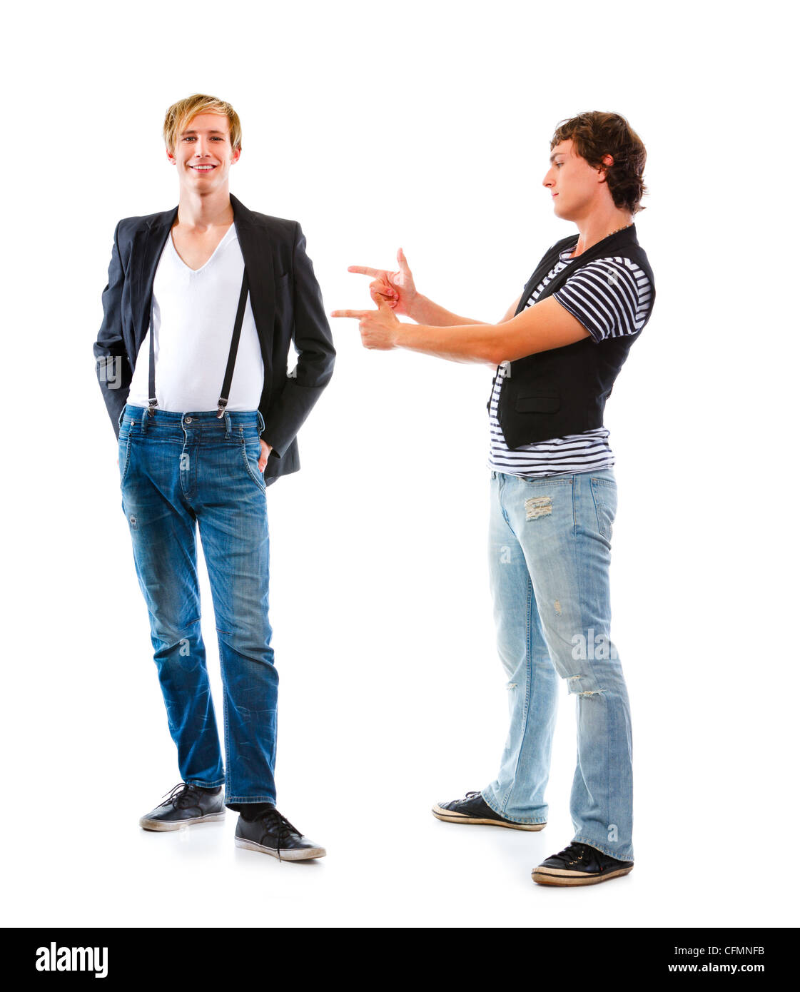 Young modern man pointing on his friend. Isolated on white Stock Photo