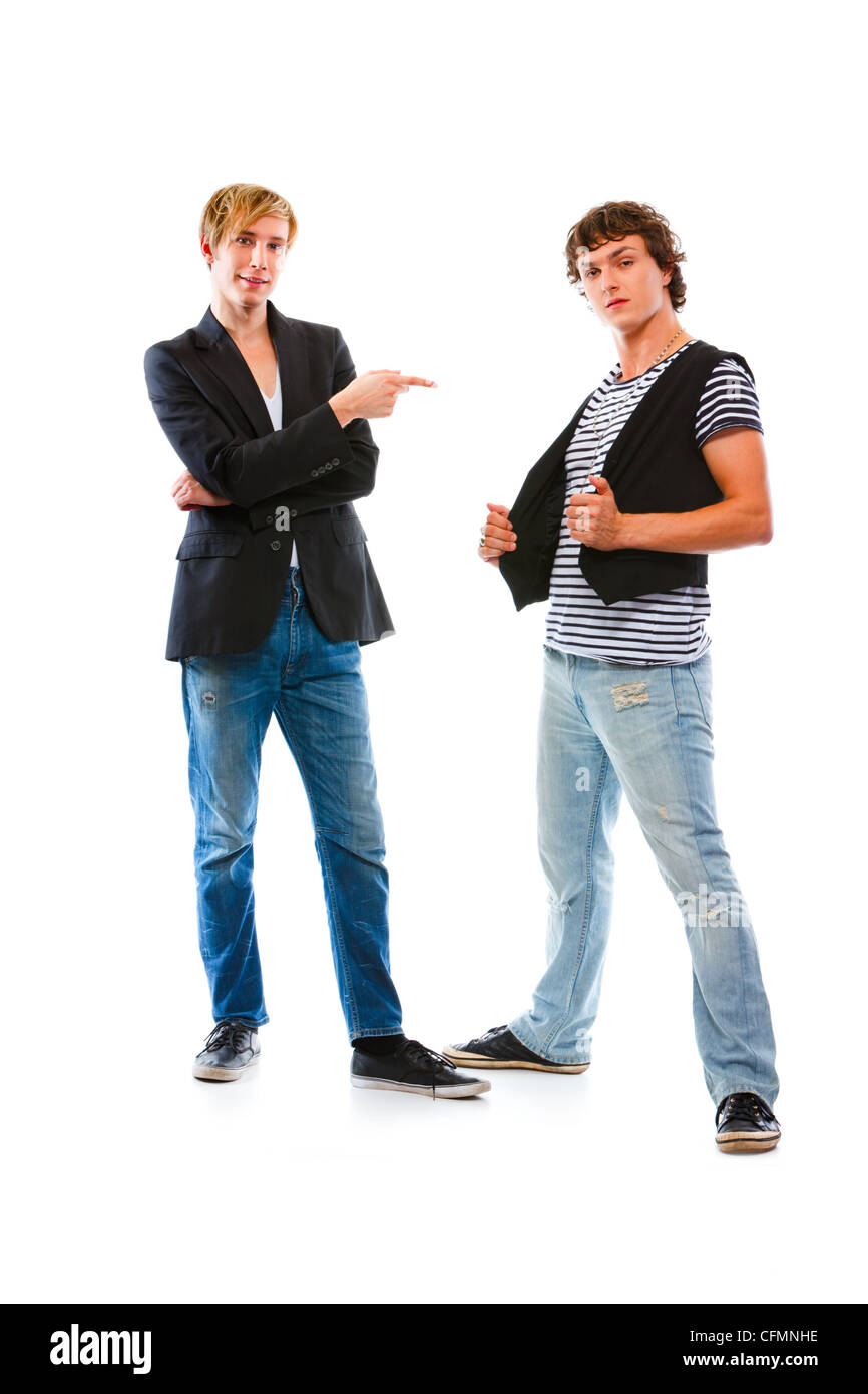 Teenager pointing on his friend. Isolated on white Stock Photo