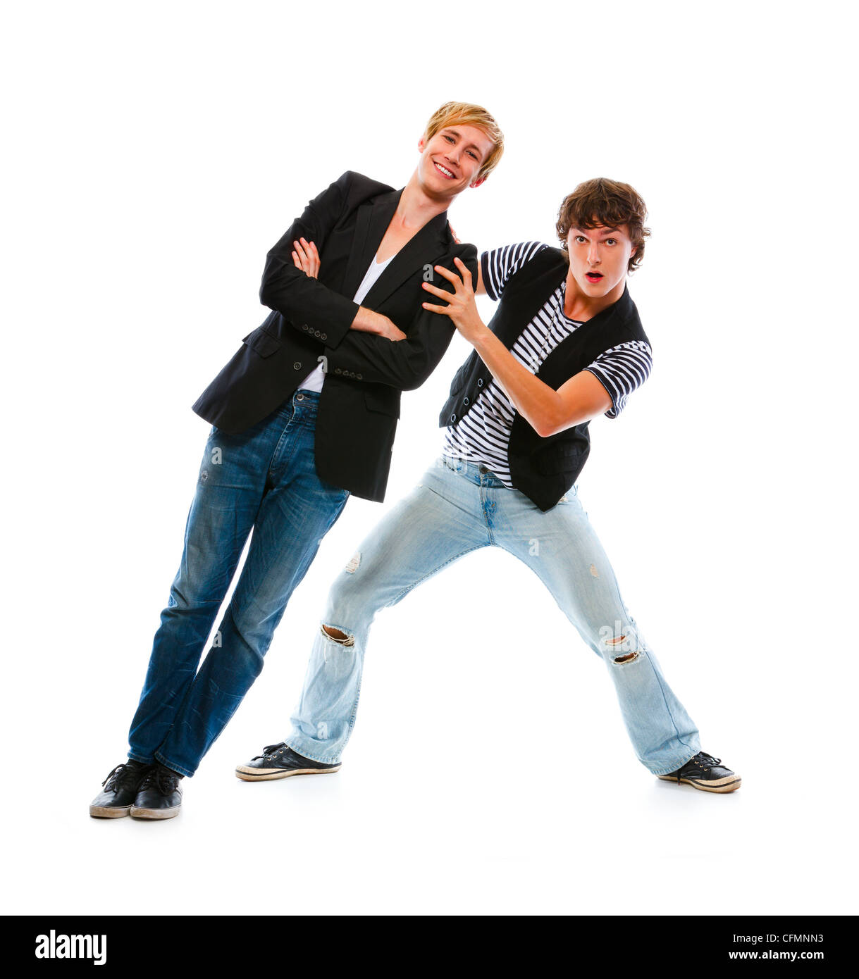 Two modern teenage boys having fun. Isolated on white Stock Photo