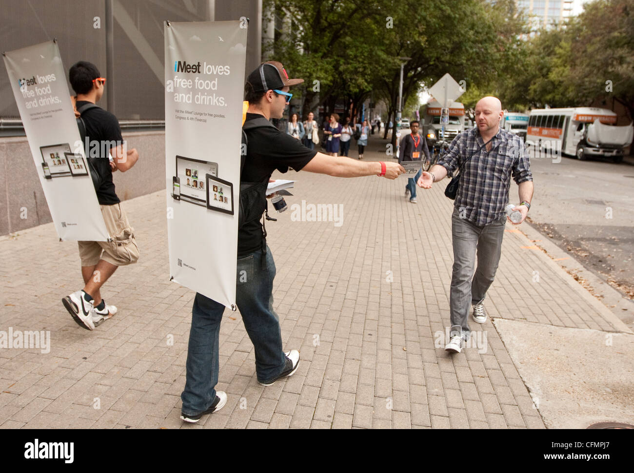 SXSW Interactive convention draws thousands. Companies use various methods of marketing to attract customers walking billboard Stock Photo