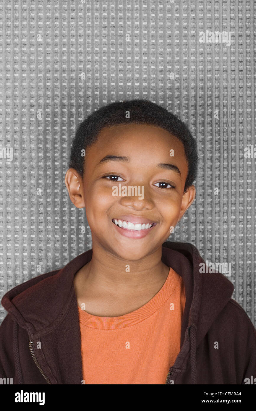 Studio portrait of young man smiling Stock Photo - Alamy