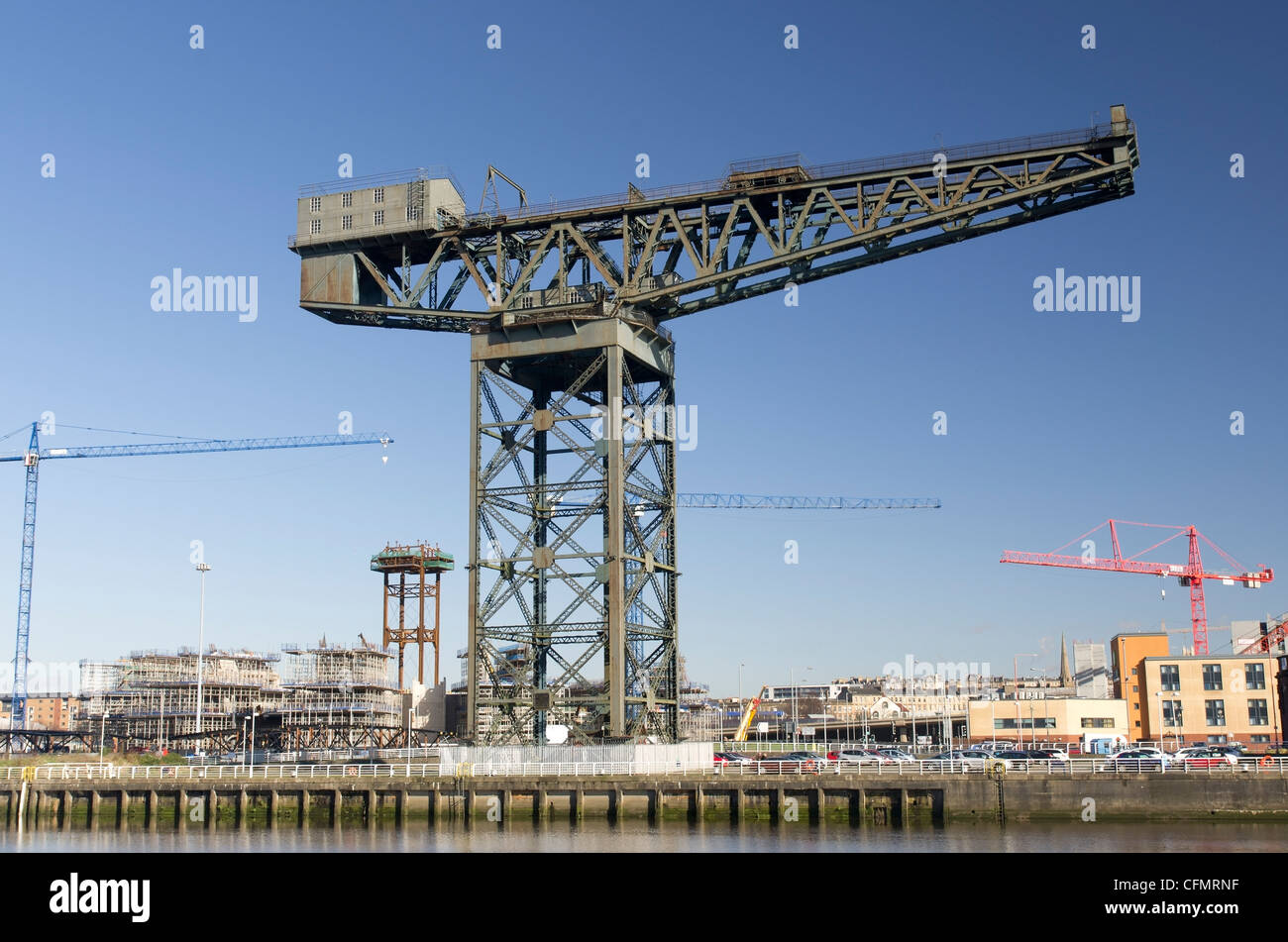 Modern and traditional cranes on the landmark quayside of River Clyde in Glasgow, Scotland Stock Photo