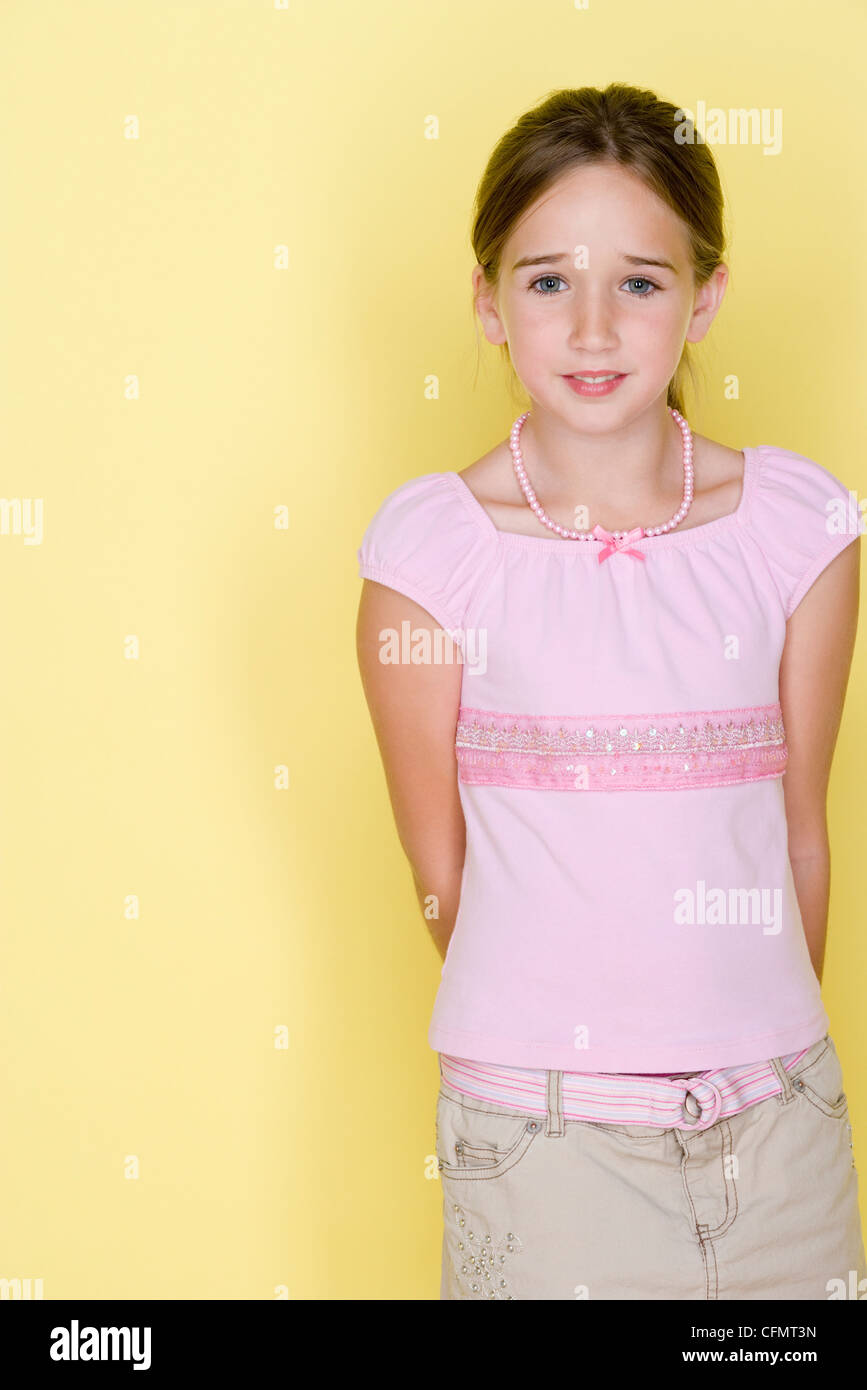 Studio shot portrait of teenage girl, three quarter length Stock Photo