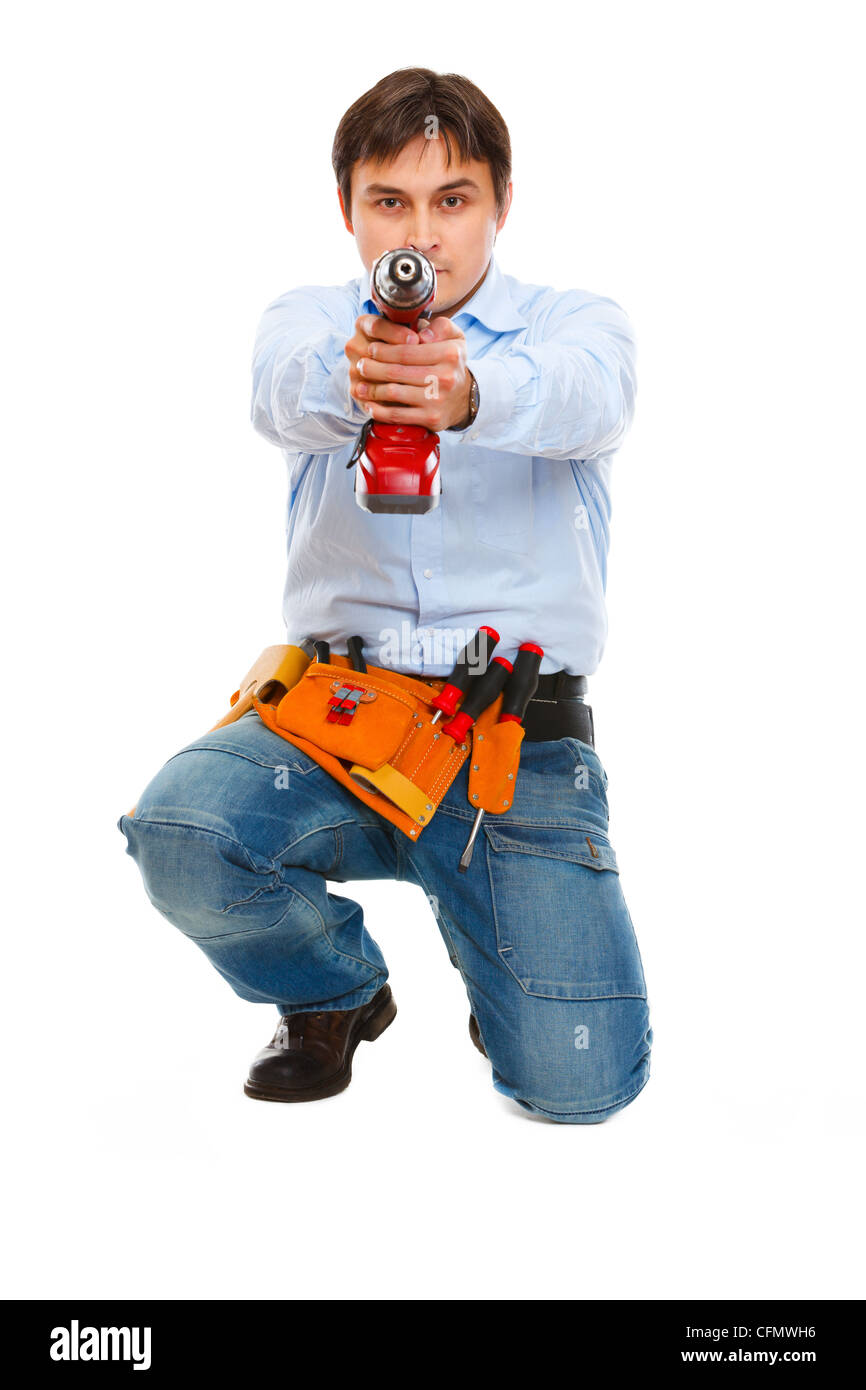 Construction worker using pointing drill as a gun in camera Stock Photo