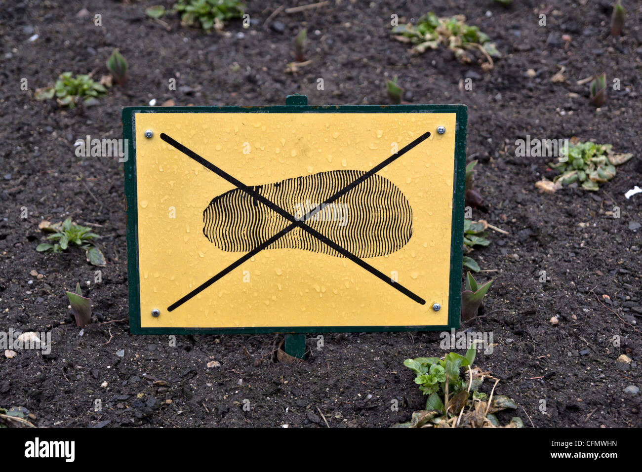 'Do not walk on garden' sign in flower bed of Old Town Square, Prague, Czech Republic Stock Photo