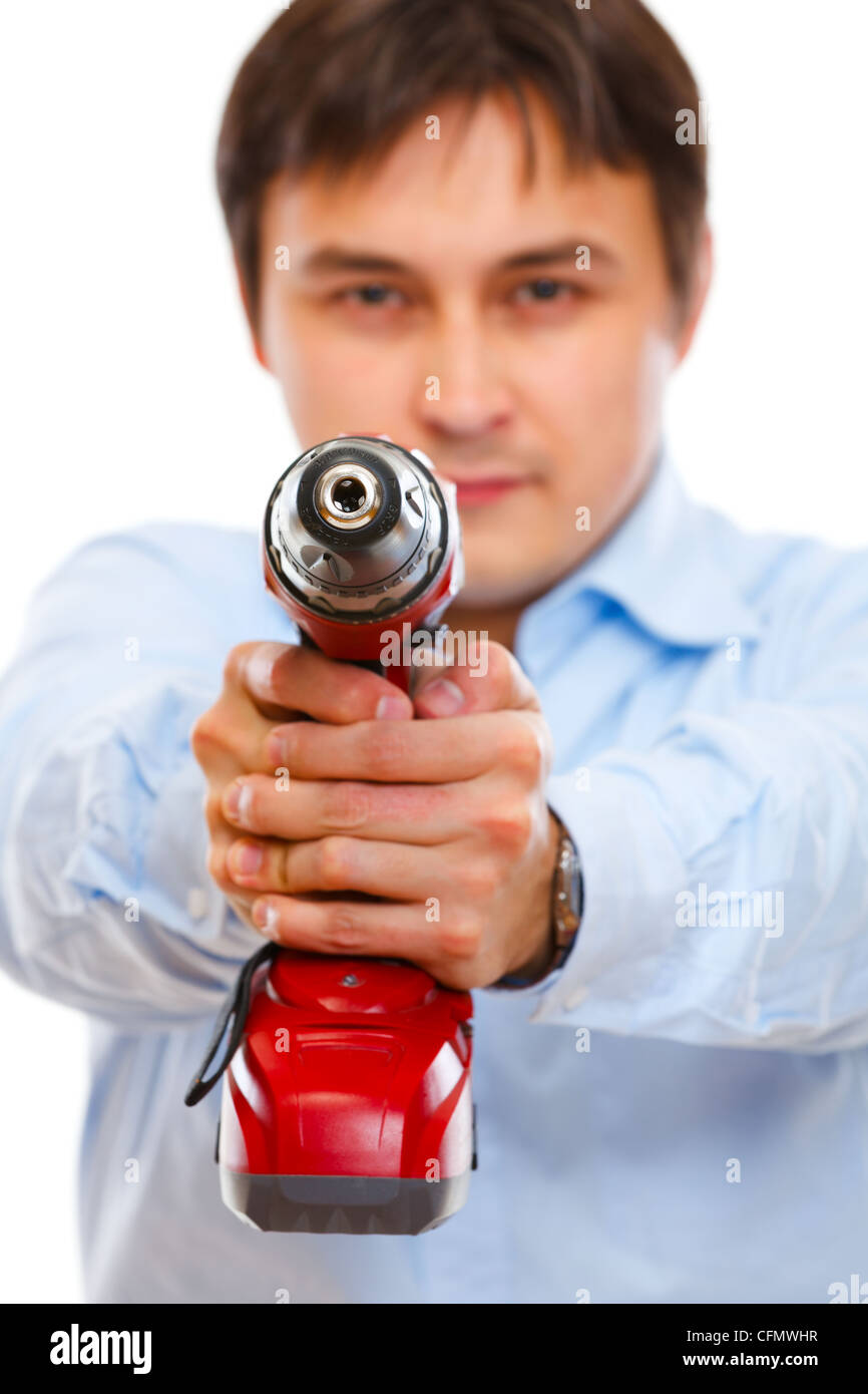 Closeup on drill pointing in camera as a gun by construction worker