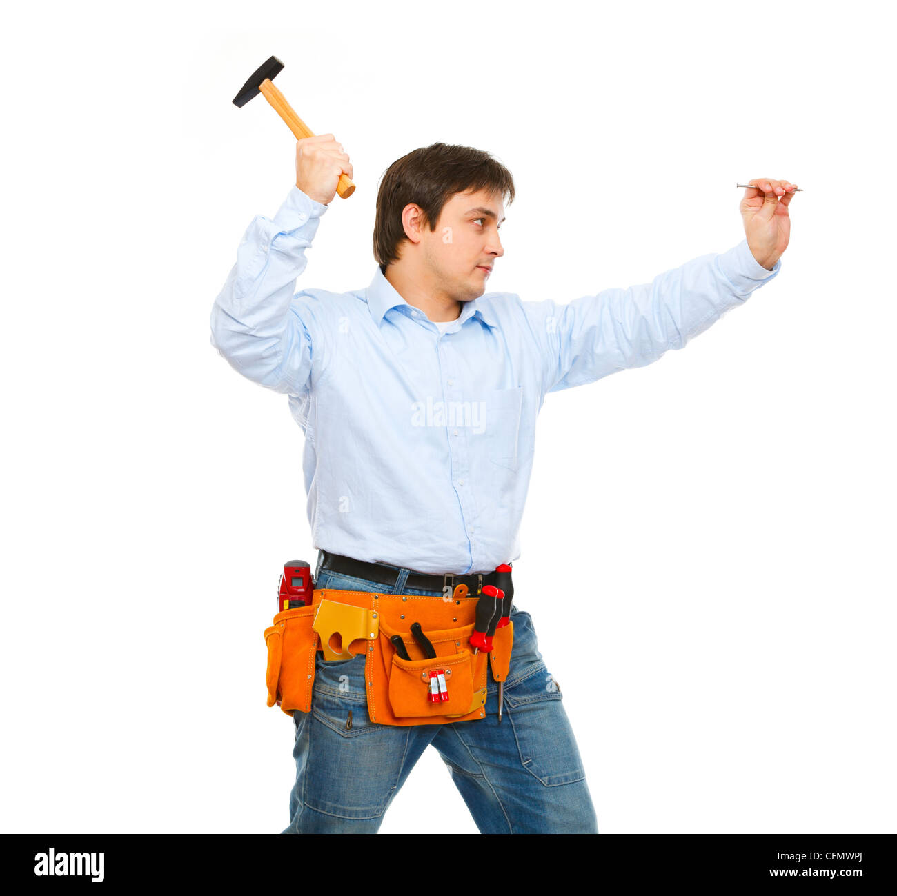 Construction worker hammering nail Stock Photo Alamy