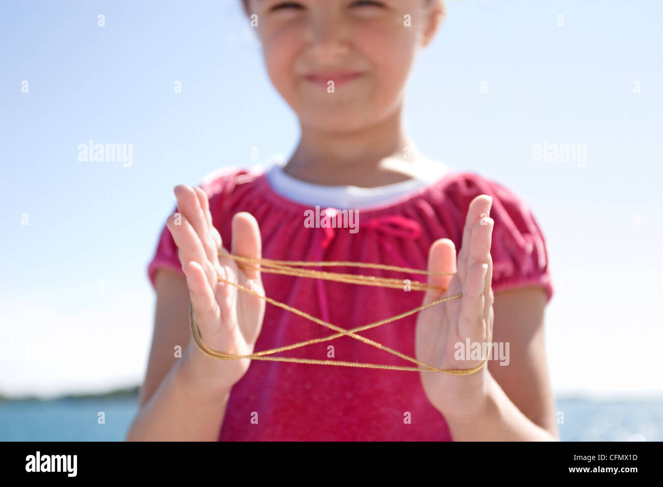 Young Girl Playing "Cat's Cradle Stock Photo Alamy