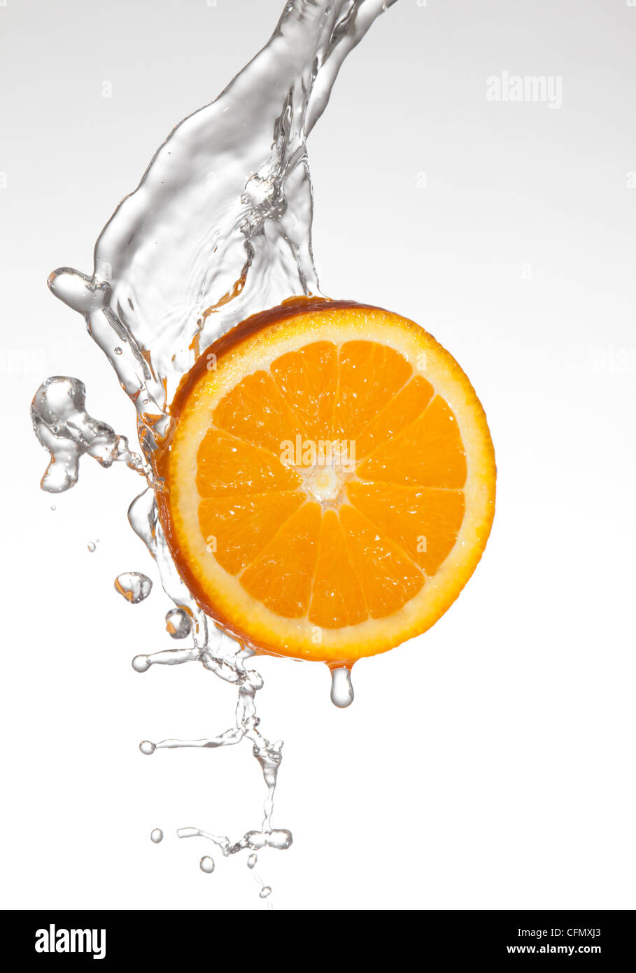 orange slice splashed with water Stock Photo