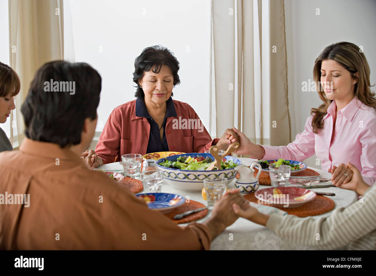 Family praying together meal dining hi-res stock photography and images ...