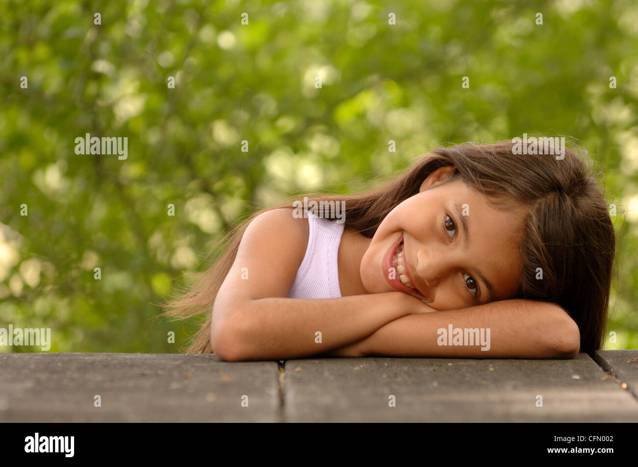 Young Girl Leaning on Wall Stock Photo