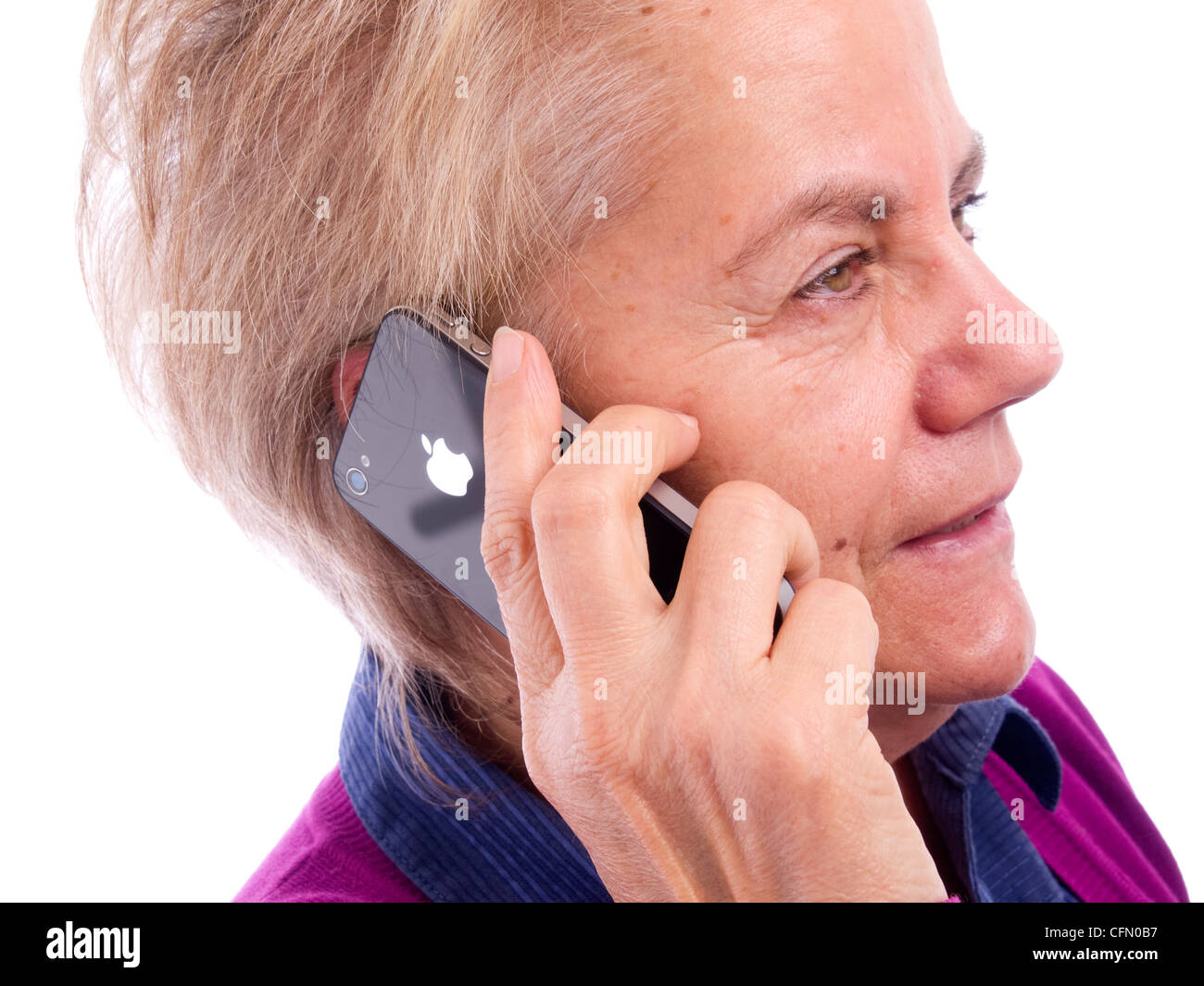 Close up of mature woman talking on iPhone Stock Photo