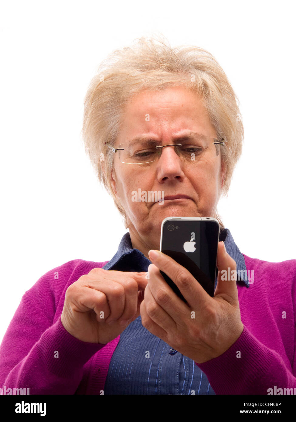 Confused mature woman using iPhone Stock Photo
