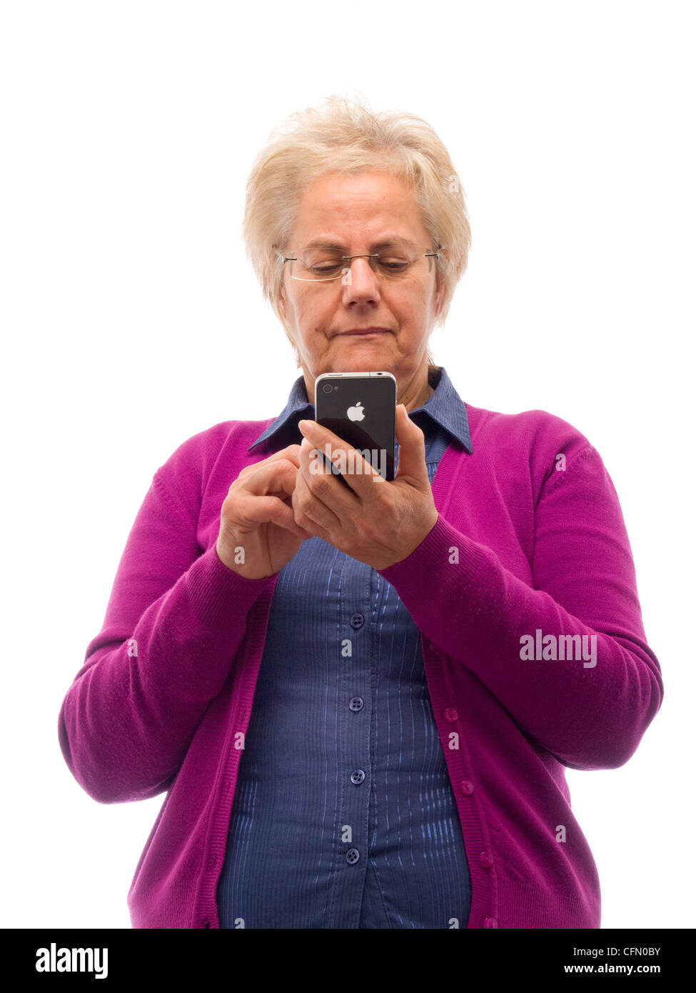 Happy mature woman using iPhone Stock Photo