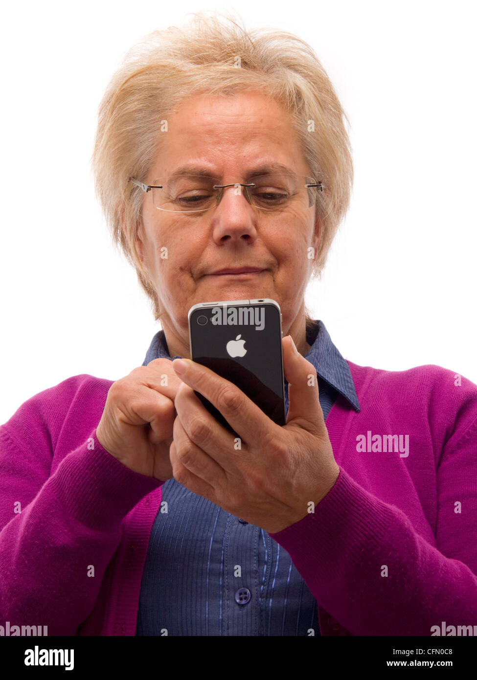 Mature woman using iPhone Stock Photo