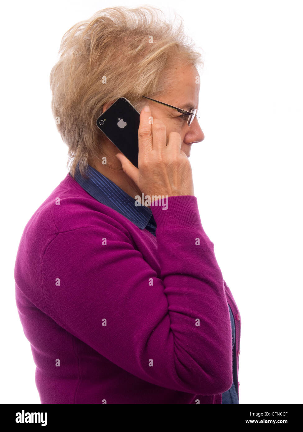 Profile view of woman talking on iPhone mobile phone Stock Photo