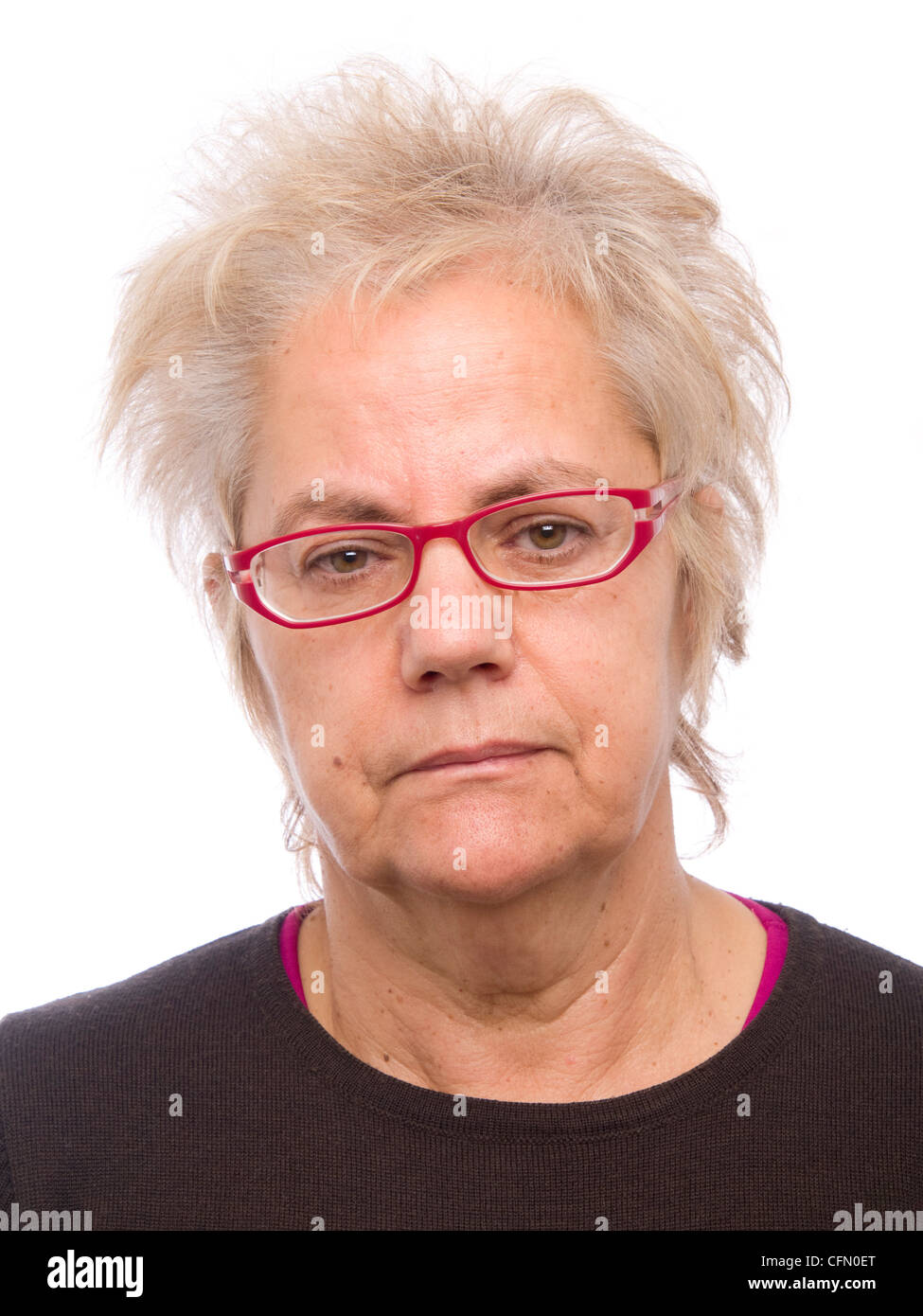 Portrait of a middle aged woman with glasses and modern hairstyle looking at camera Stock Photo