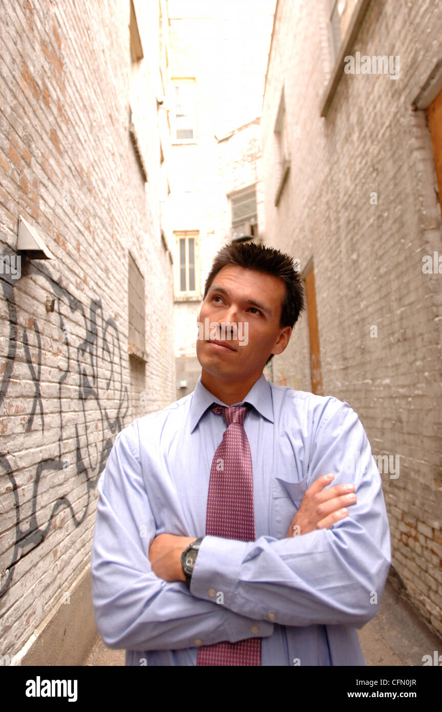 Man Standing in Alley Stock Photo