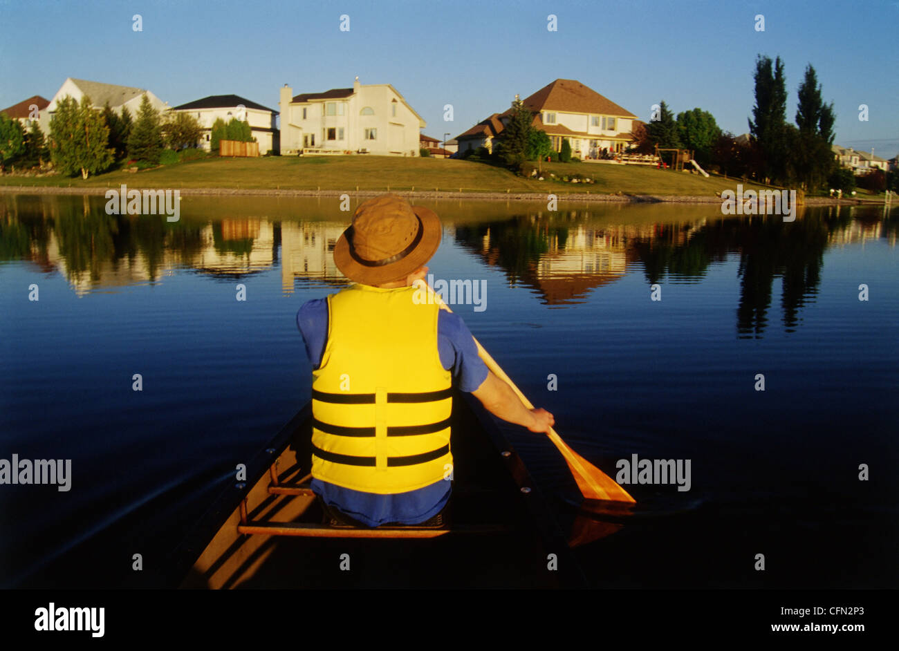 Person Canoeing on Lake, Winnipeg, Manitoba Stock Photo