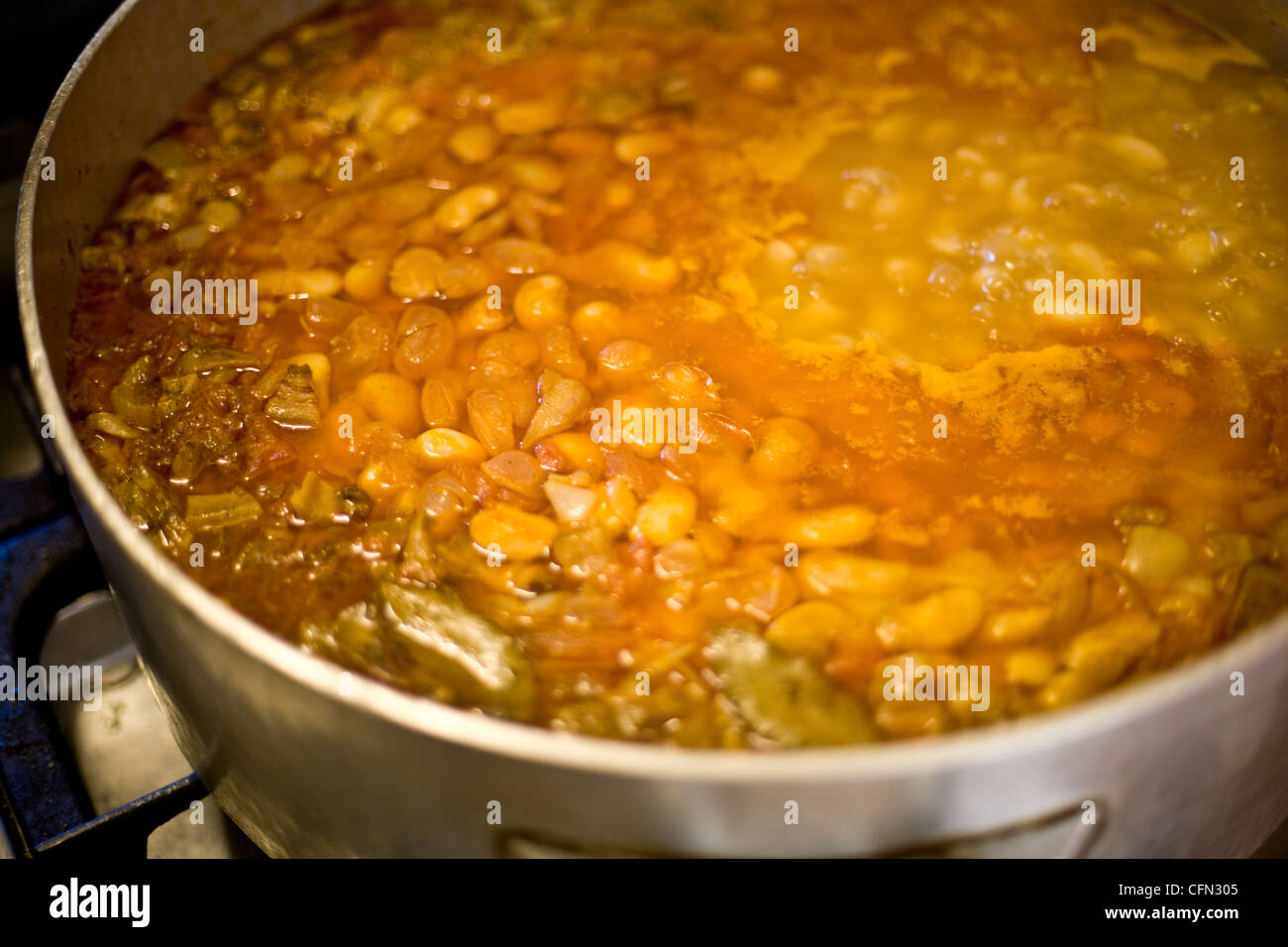 A home-cooked pot of Corsican minestrone made with beans, pork and vegetables (zuppa corsa), in Zonza, in the Alta Rocca region of Corsica, France. Stock Photo