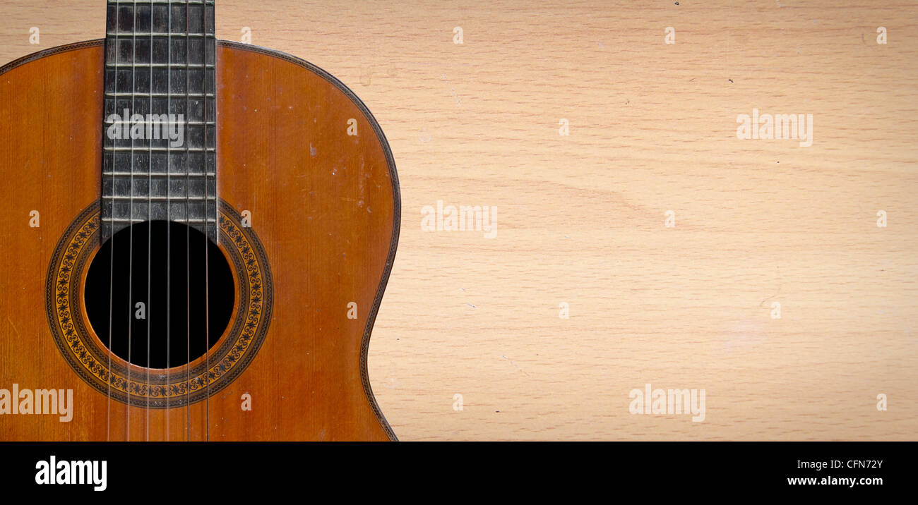 Classical guitar on plywood background Stock Photo