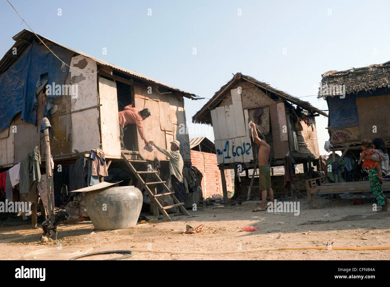 People are living in poverty in wooden shacks near the toxic and