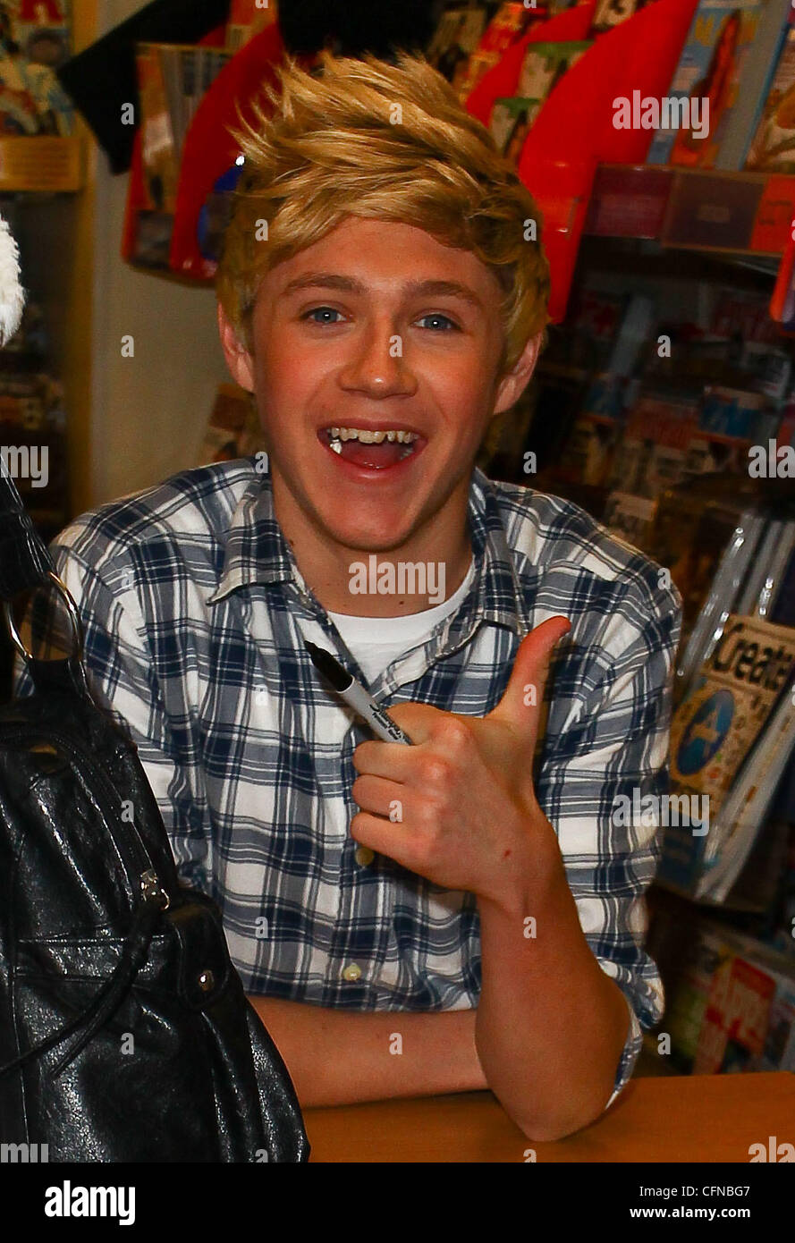Niall Horan One Direction Promoting And Signing Copies Of Their New Book 1d One Direction Forever Young At Wh Smiths In Birmingham Wh Smiths Reported That The Wrist Bands Sold To