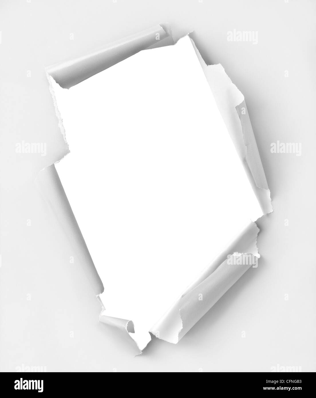 Hole ripped paper. Clipping path inside the hole. Stock Photo