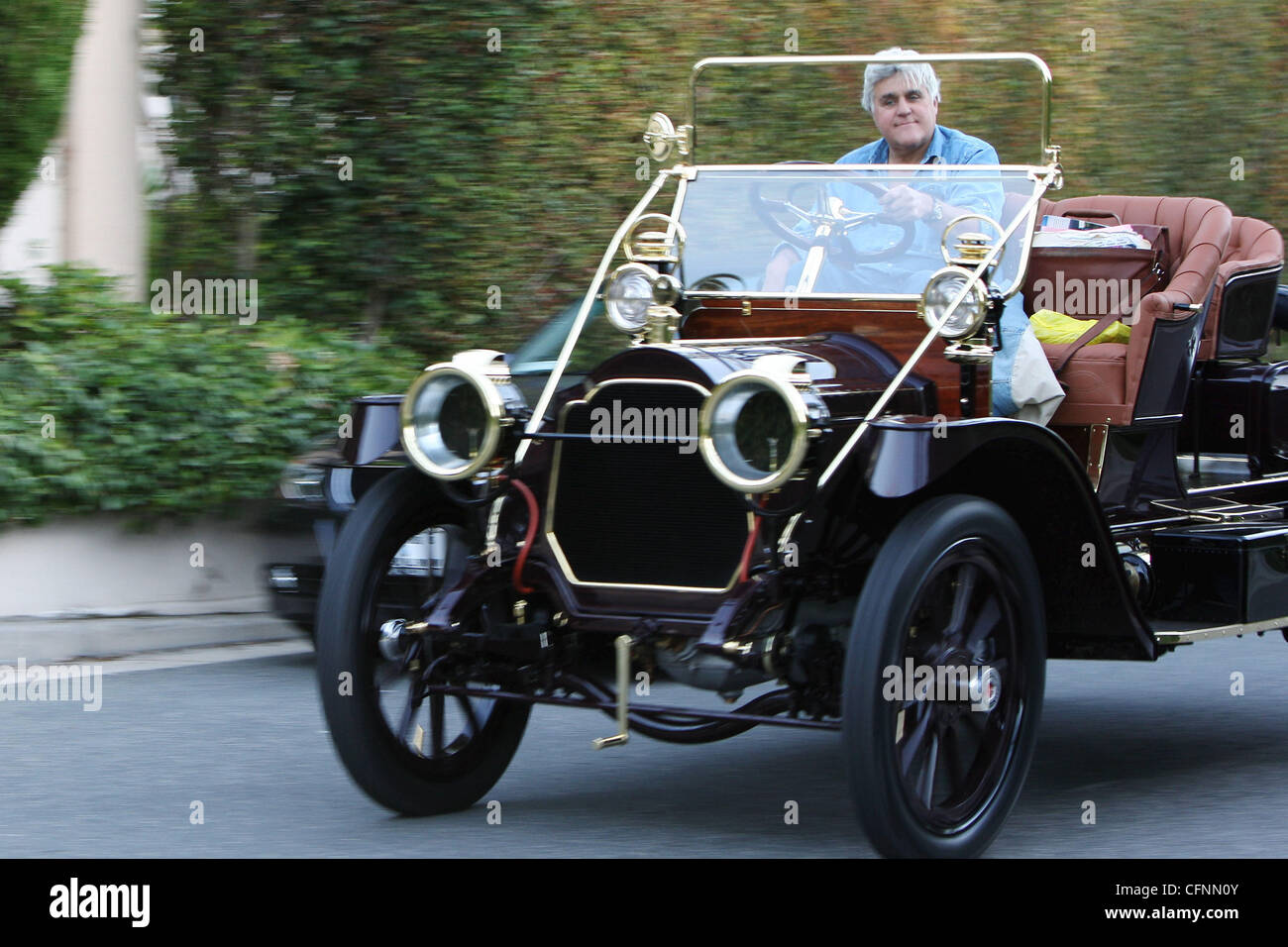 Jay Leno drives through Beverly Hills in a vintage classic automobile Beverly Hills, Los Angeles - 12.02.11 Stock Photo