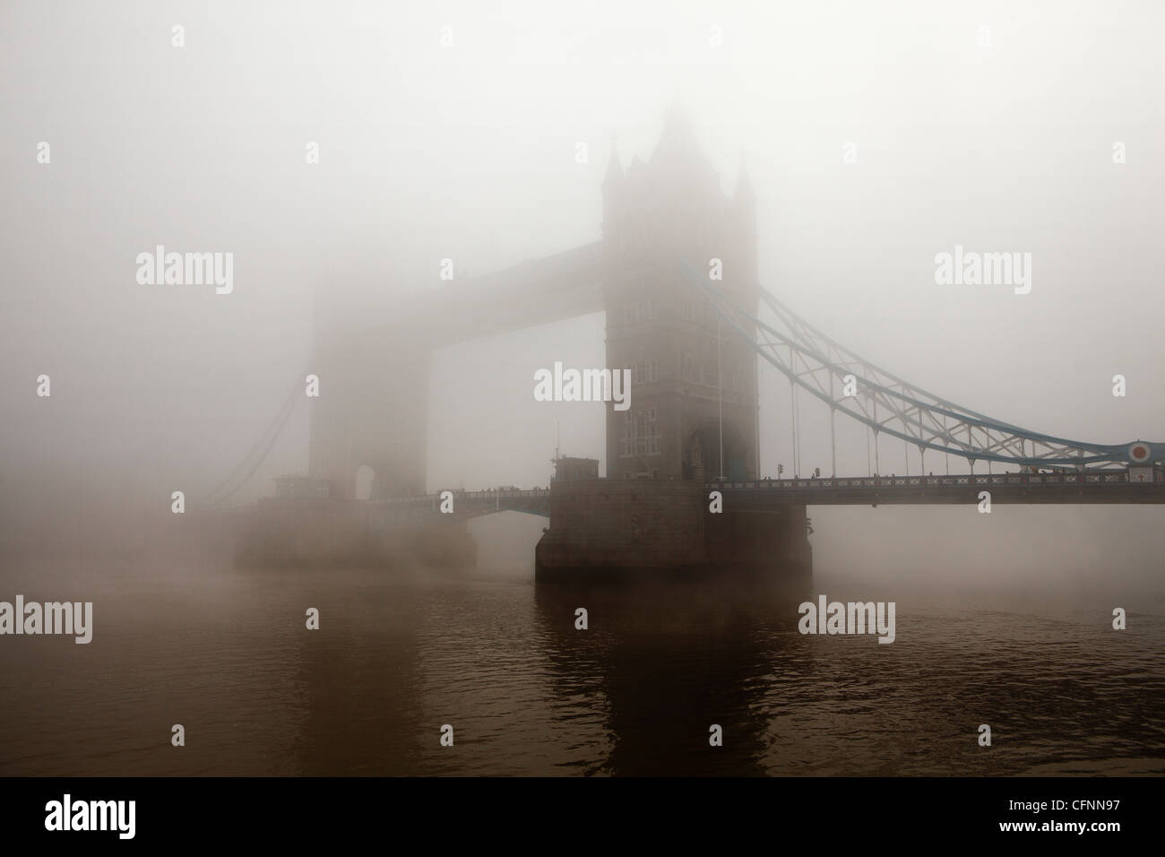 A view of Tower Bridge completely covered in morning mist Stock Photo