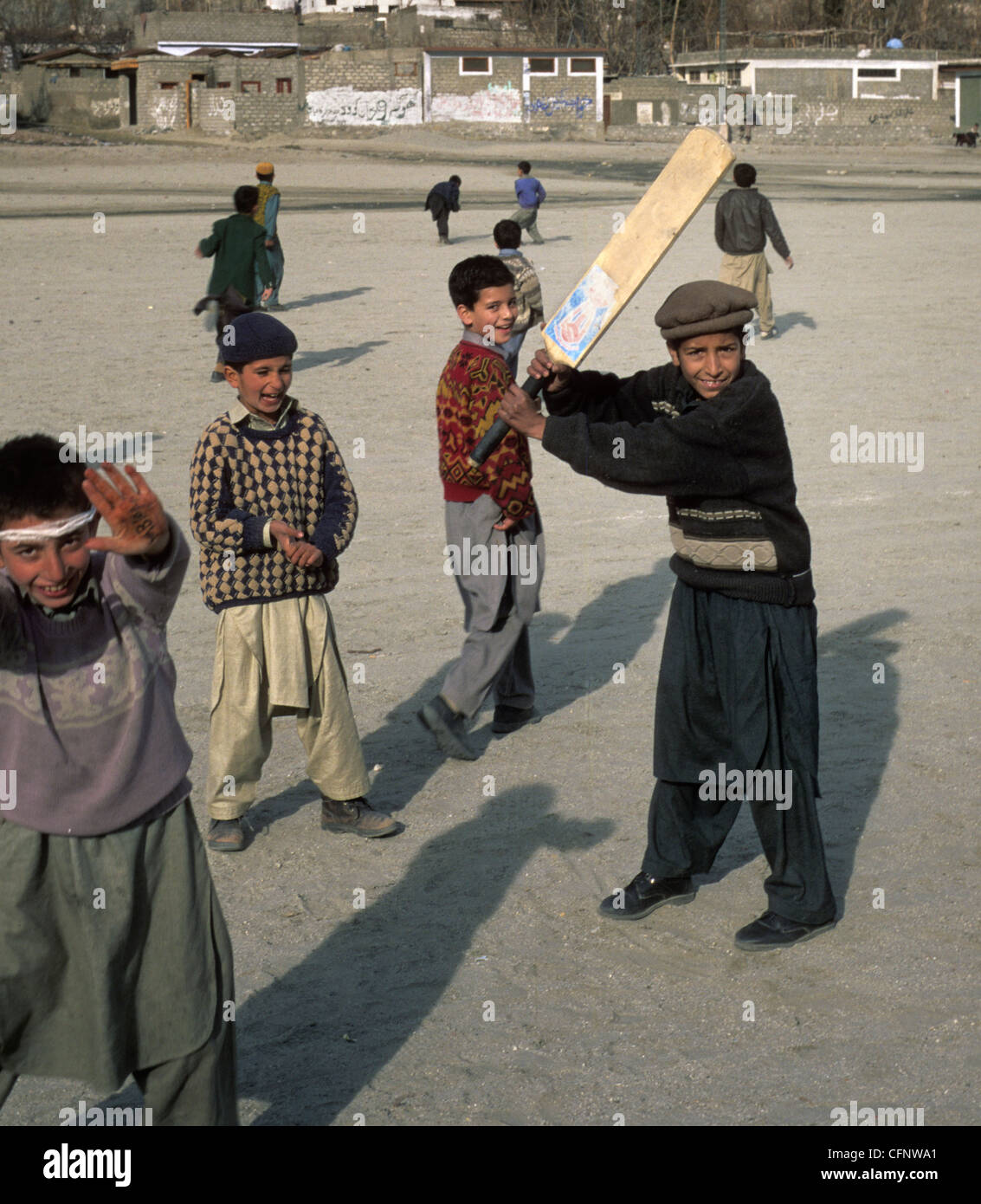 Children playing cricket in the village of Karimabad in Hunza Valley, Pakistan. Stock Photo