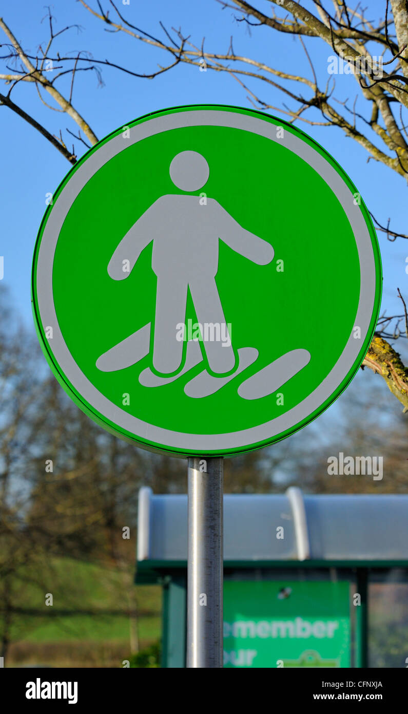 Pedestrian crossing sign. ASDA Supermarket, Burton Road, Kendal, Cumbria, England, United Kingdom, Europe. Stock Photo
