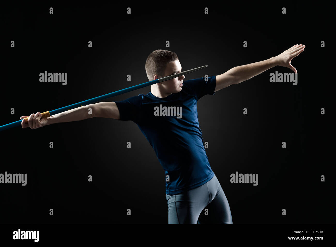 Male athlete preparing to throw javelin Stock Photo