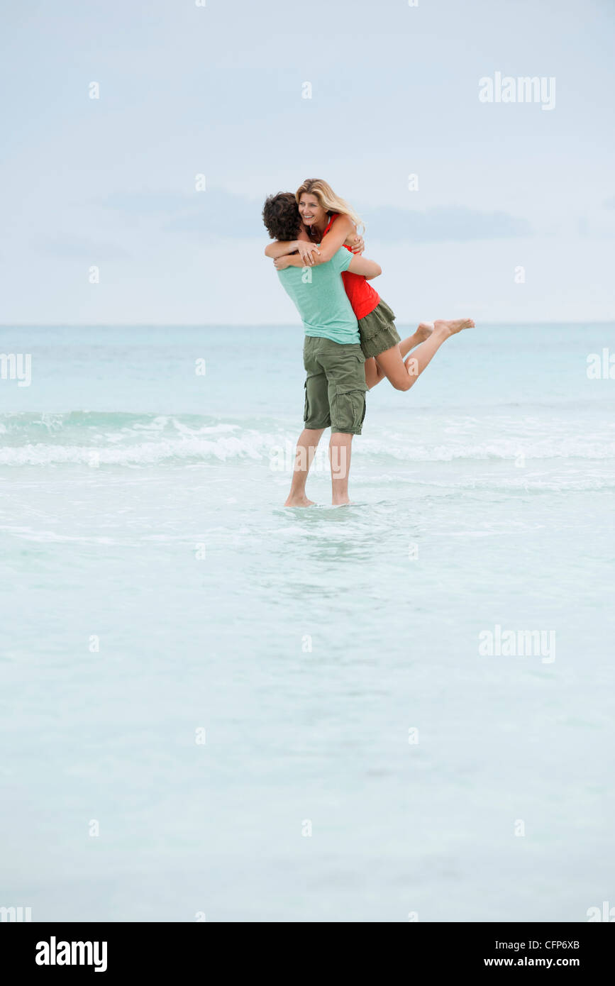 Couple embracing at the beach Stock Photo